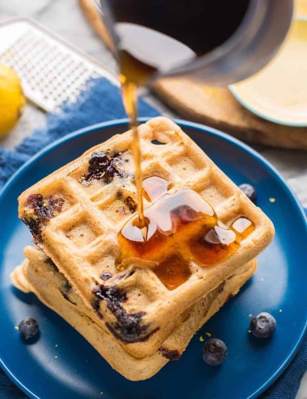 Gluten Free Blueberry Waffles with syrup pouring over top