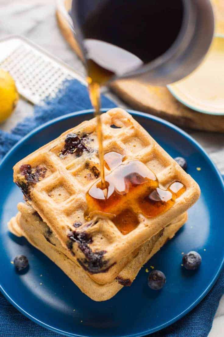 Gluten Free Blueberry Waffles with syrup pouring over top