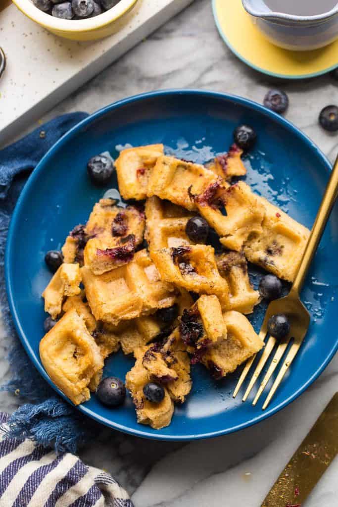 Gluten Free Blueberry Waffles cut up on a plate