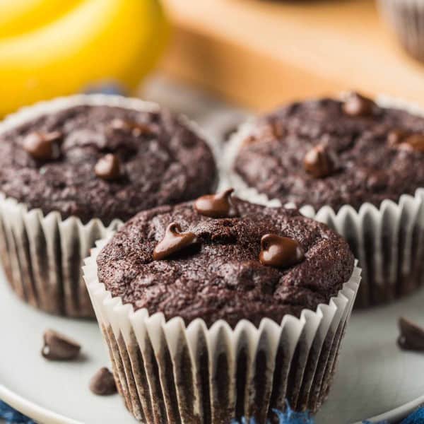 three Paleo Chocolate Banana Muffins on a small plate