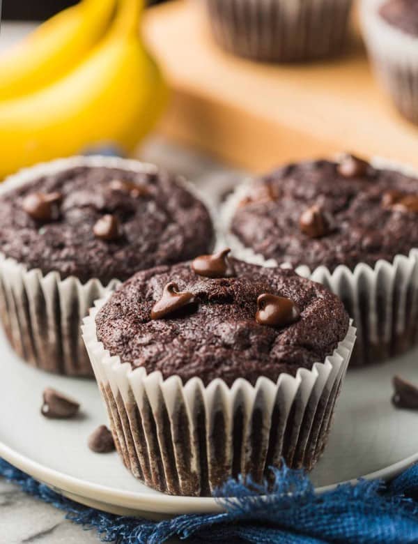 three Paleo Chocolate Banana Muffins on a small plate