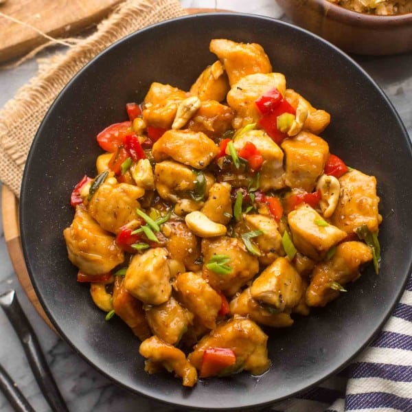 paleo cashew chicken in a black serving bowl