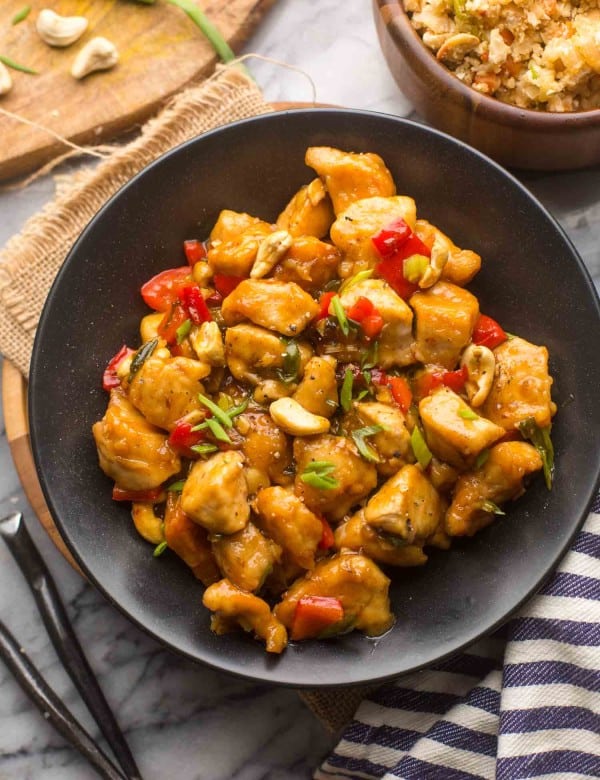 paleo cashew chicken in a black serving bowl