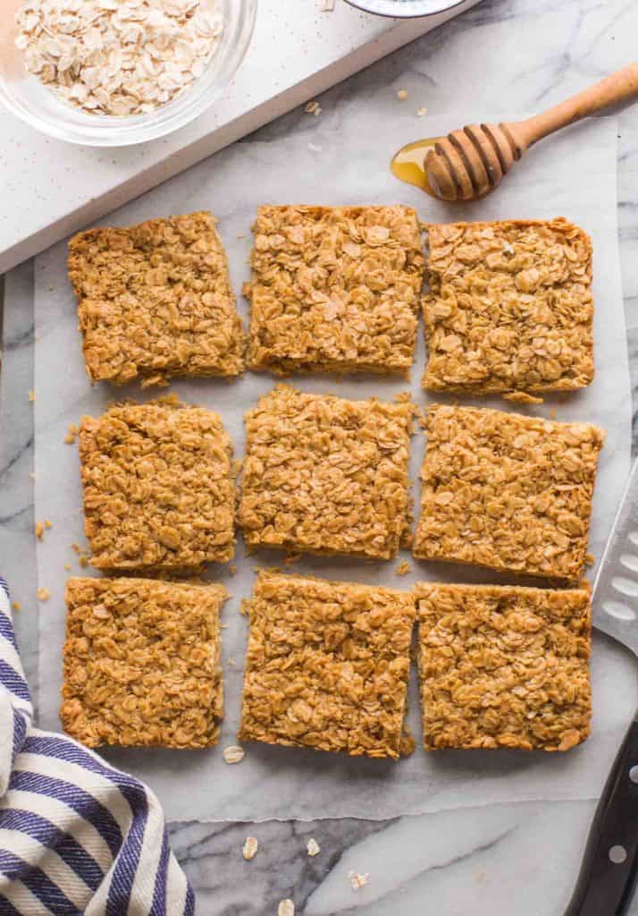 Gluten Free Flapjacks cut into slices on a marble surface 