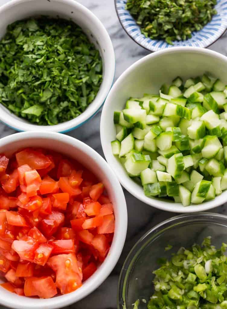 salad ingredients diced and chopped in little bowls