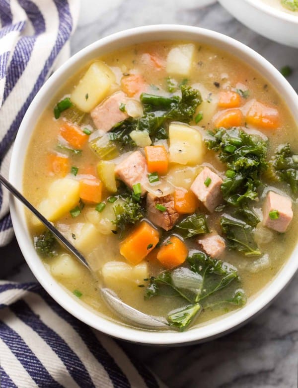 dairy free ham and potato soup in a white soup bowl