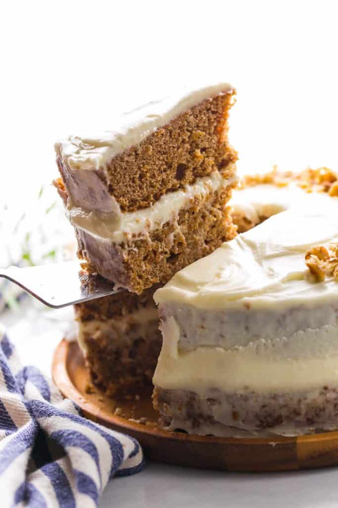 cake knife holding up a slice of Gluten Free Carrot Cake