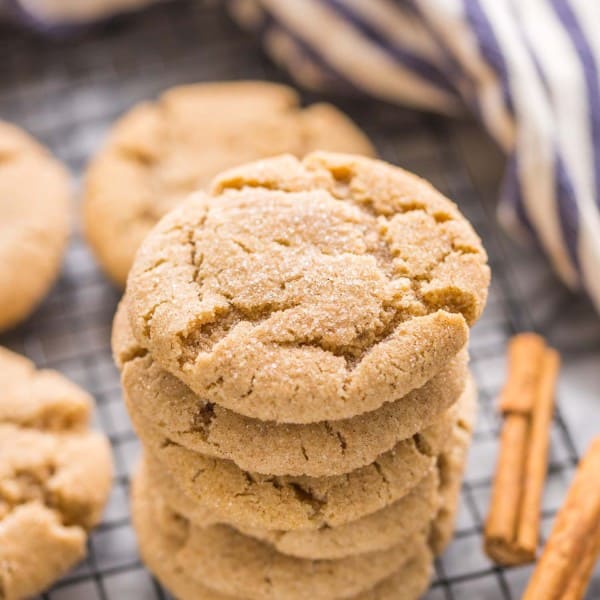 Almond Flour Snickerdoodles stacked on a wire cooling rack