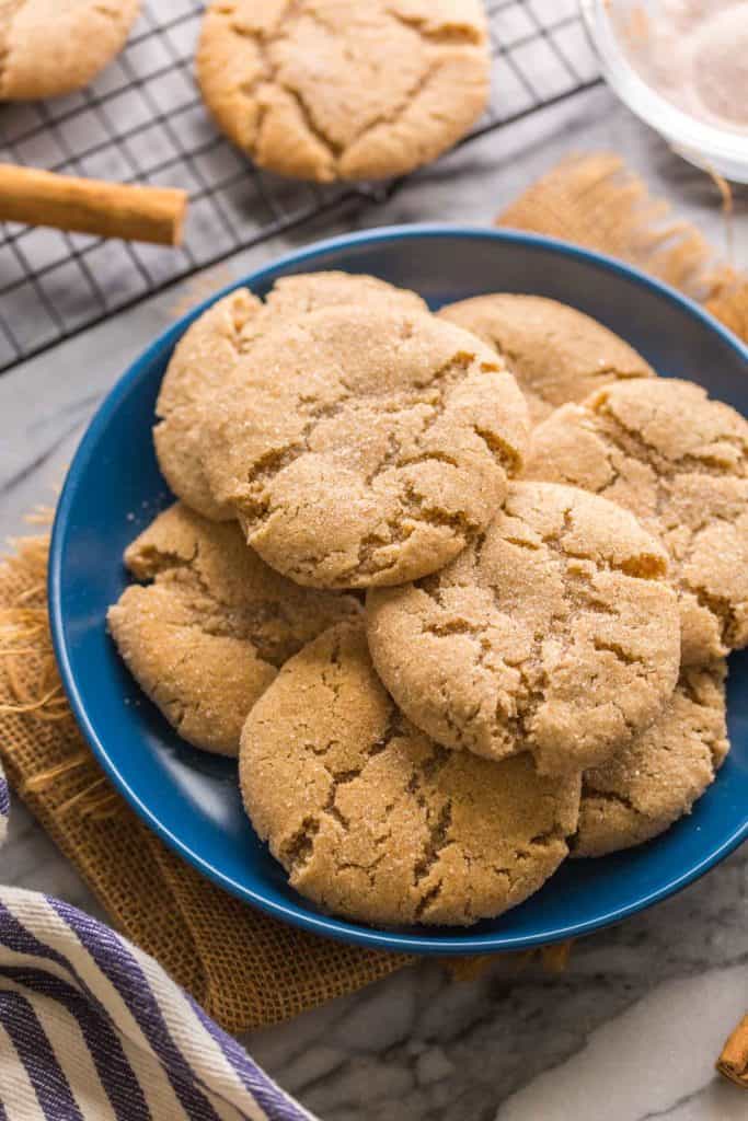 Almond Flour Snickerdoodles piled on a blue plate