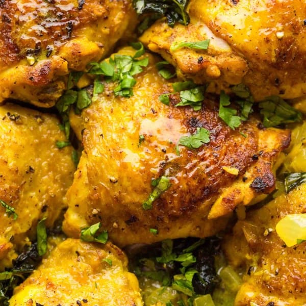 Coconut-Turmeric-Chicken-Thighs up close and sprinkled with cilantro