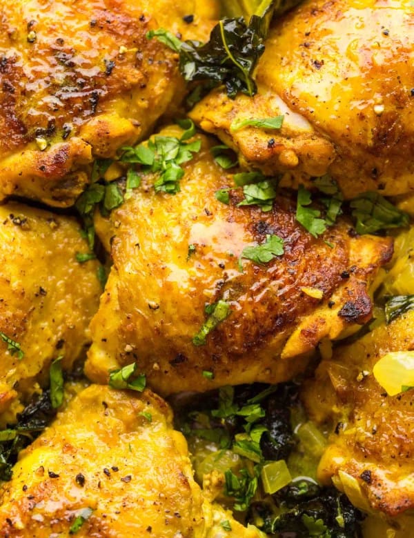 Coconut-Turmeric-Chicken-Thighs up close and sprinkled with cilantro