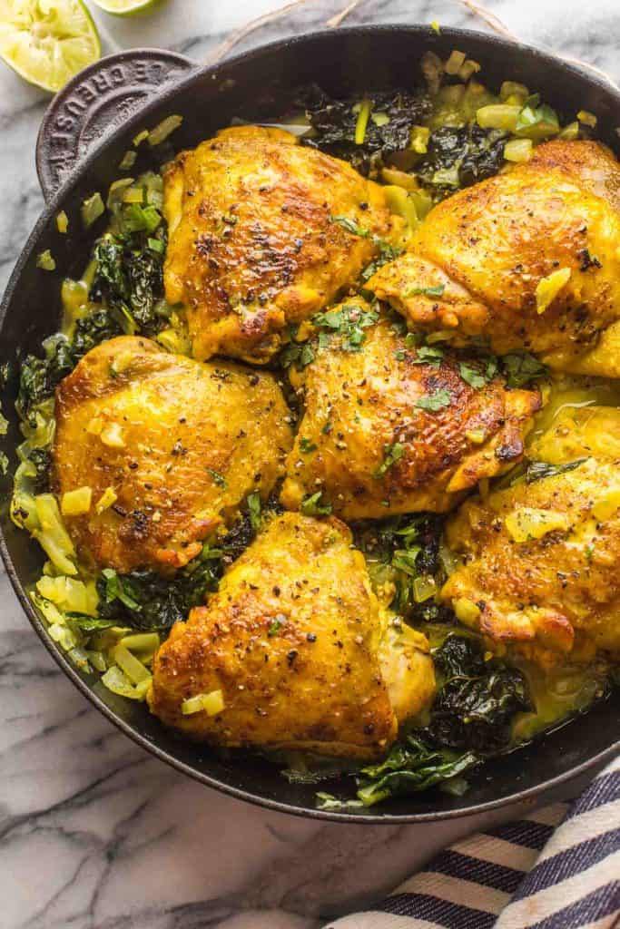 One Pan Coconut Turmeric Chicken Thighs in a cast iron skillet