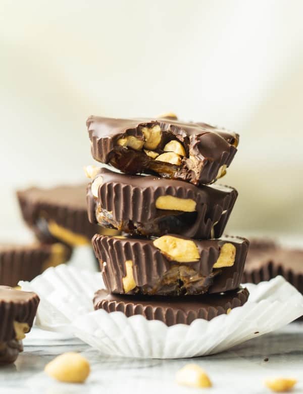 a small stack of three Caramel-y Peanut Chocolate Cups