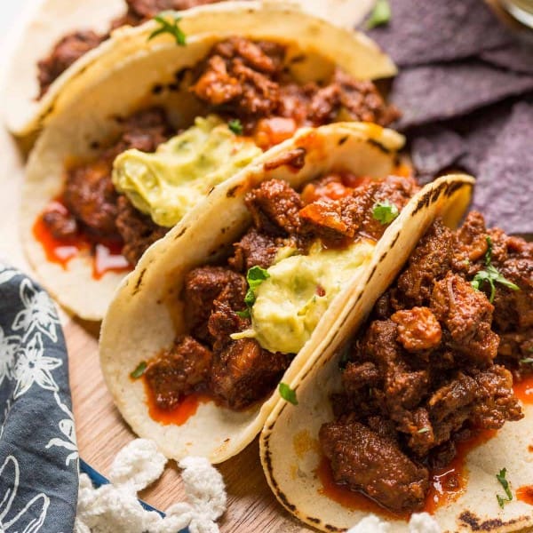 Instant-Pot-Adobada-Tacos_ on a wooden plate