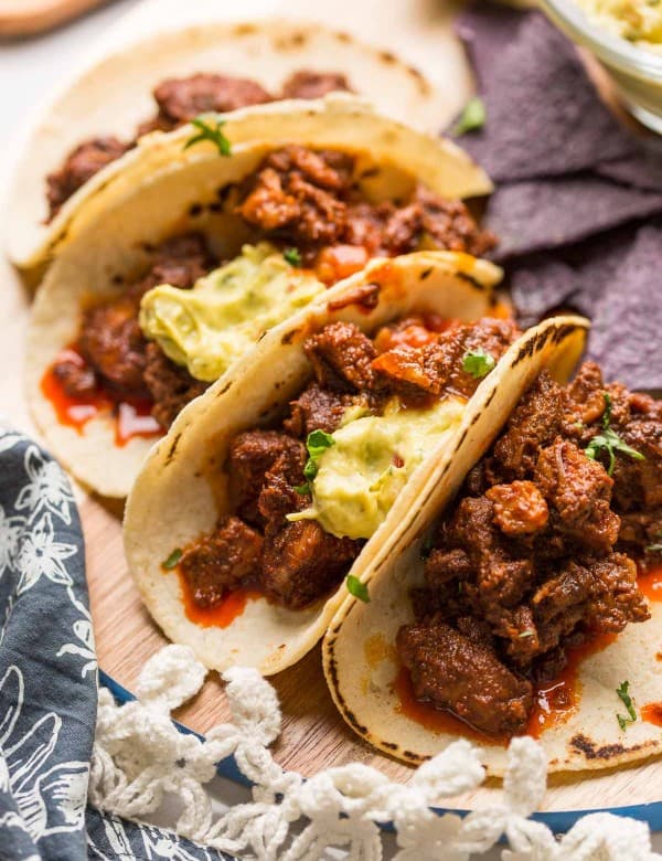 Instant-Pot-Adobada-Tacos_ on a wooden plate