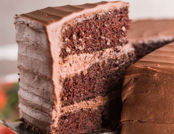 slice of gluten free chocolate cake picked up by a spatula