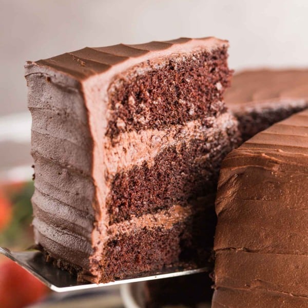 slice of gluten free chocolate cake picked up by a spatula