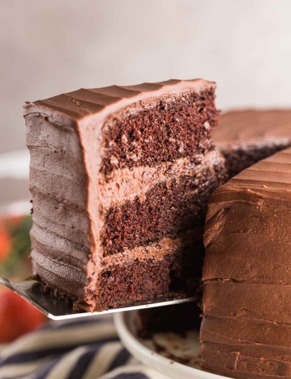 slice of gluten free chocolate cake picked up by a spatula