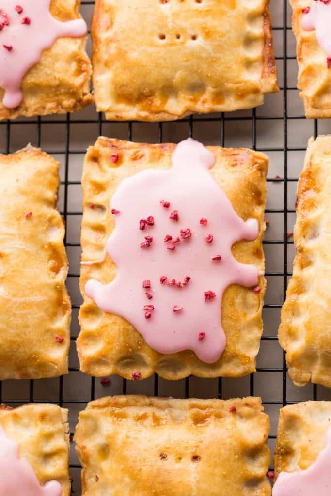 Strawberry Hand Pies up close cooling on a wire rack
