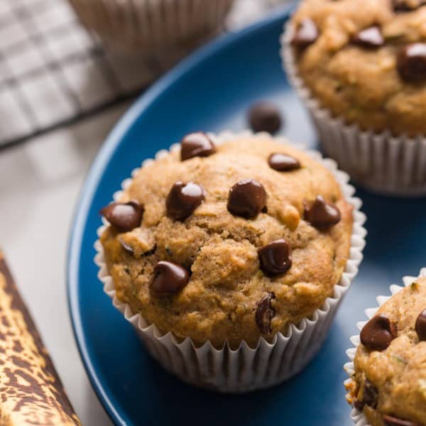 a few Banana Zucchini Muffins on a plate