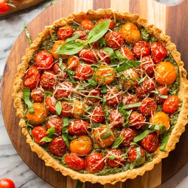 almond flour tomato tart topped with basil