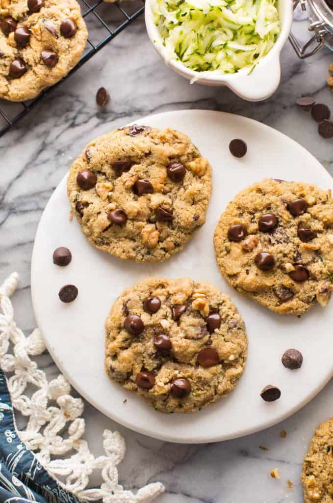 Chocolate Chip Almond Flour Zucchini Cookies on a serving board with chocolate chips