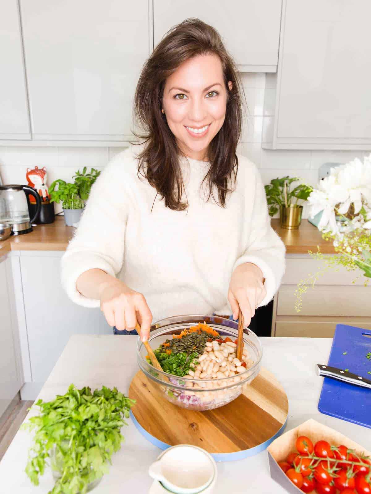 Sarah Nevins from A Saucy Kitchen making a salad