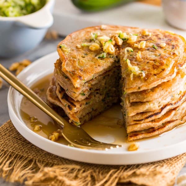 stack of zucchini pancakes with a big slice taken out