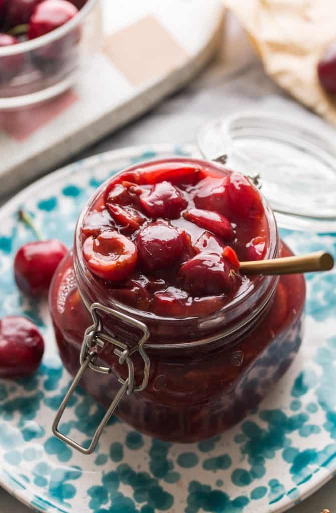cherry pie filling in a jar on a plate