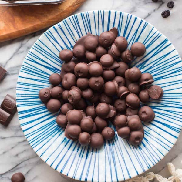 Chocolate-Covered-Blueberries in a blue and white striped bowl