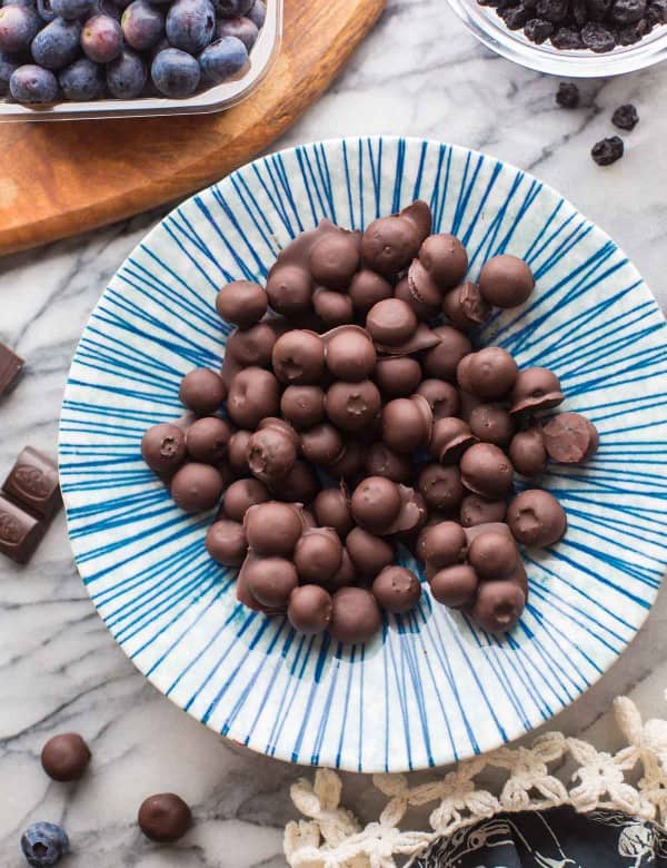 Chocolate-Covered-Blueberries in a blue and white striped bowl