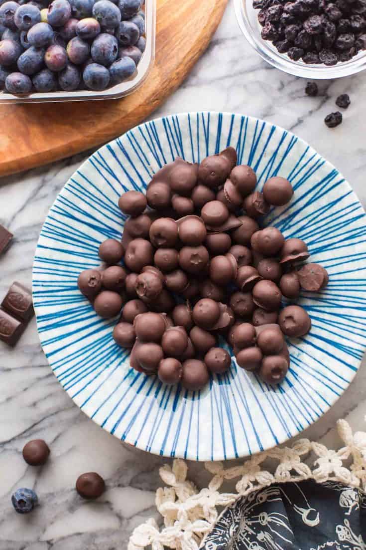 Chocolate-Covered-Blueberries in a blue and white striped bowl