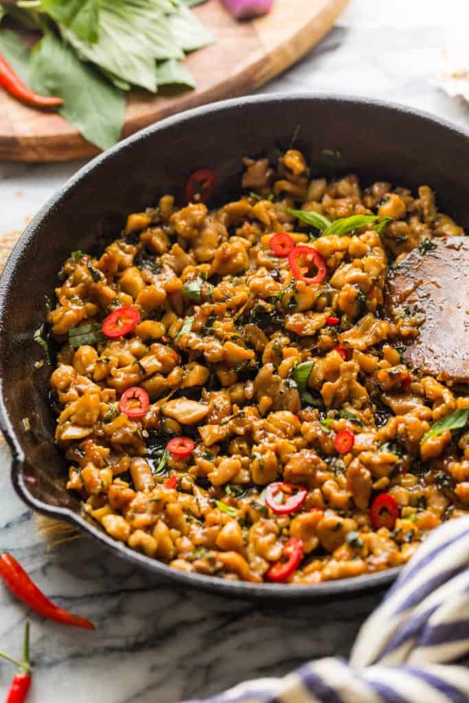 Thai Basil Chicken in a cast iron skillet up close