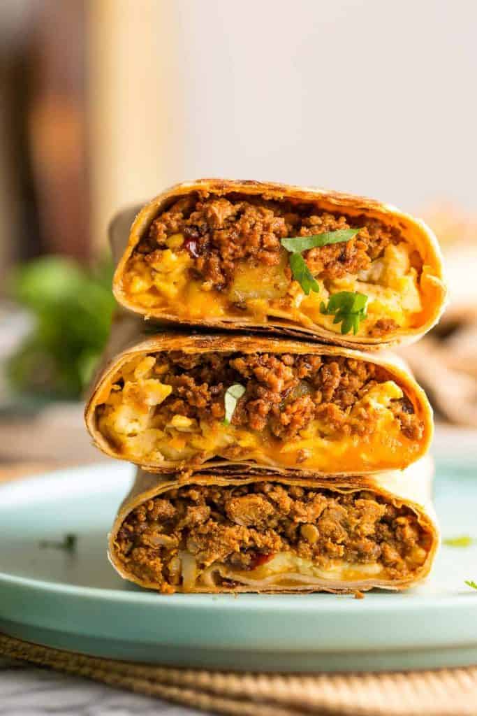 Turkey Chorizo Breakfast Burritos stacked and cut in half