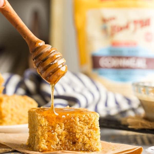 gluten free cornbread with honey drizzling over the top