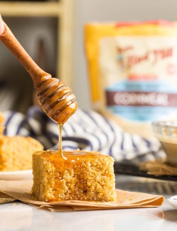 gluten free cornbread with honey drizzling over the top