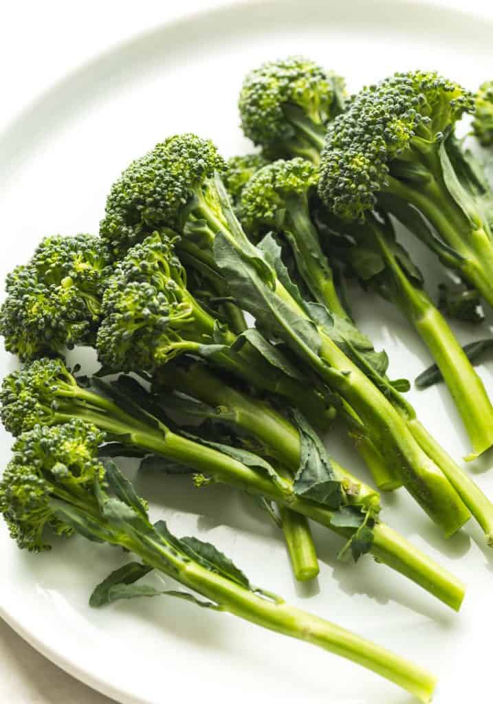 raw tenderstem broccoli on a plate
