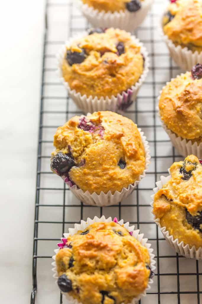 Gluten Free Blueberry Cornbread Muffins cooling on a wire rack