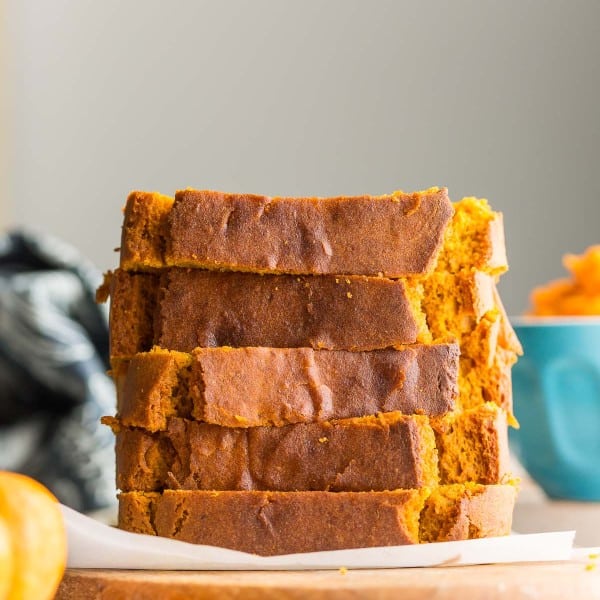 five slices of gluten free pumpkin bread stacked on top of each other