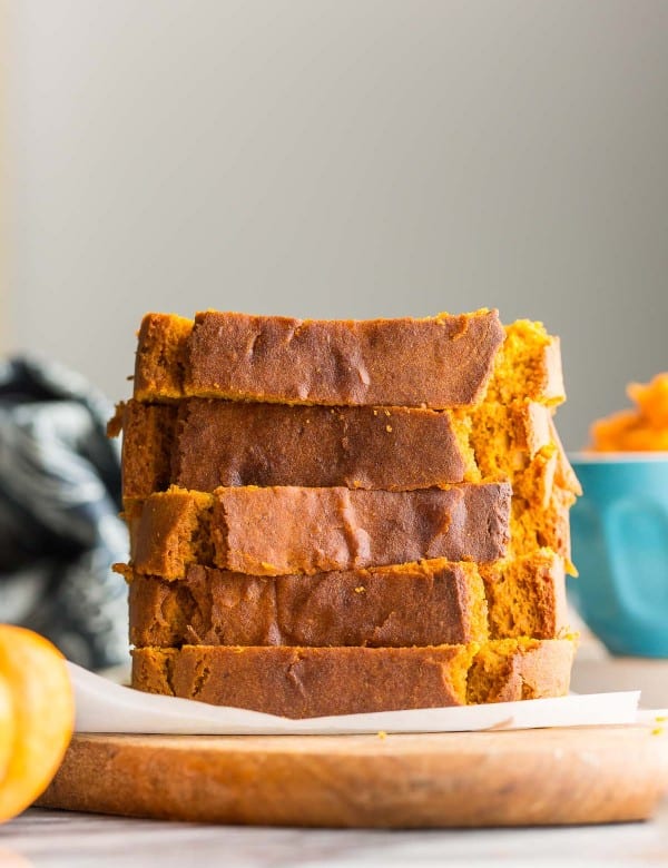 five slices of gluten free pumpkin bread stacked on top of each other