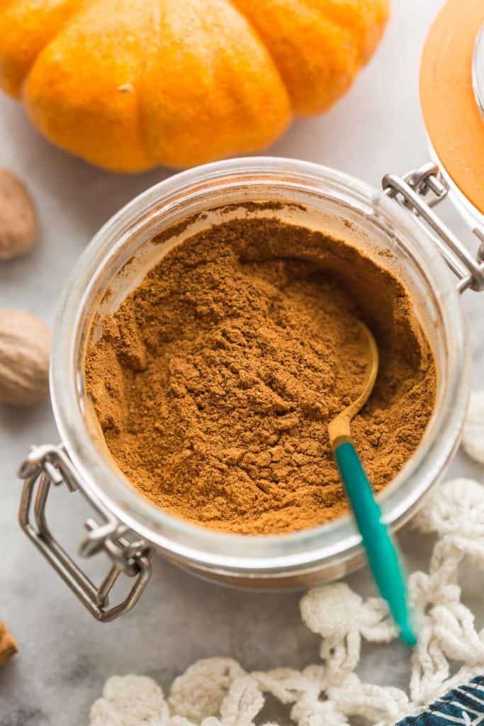 homemade pumpkin pie spice recipe in a jar with a spoon