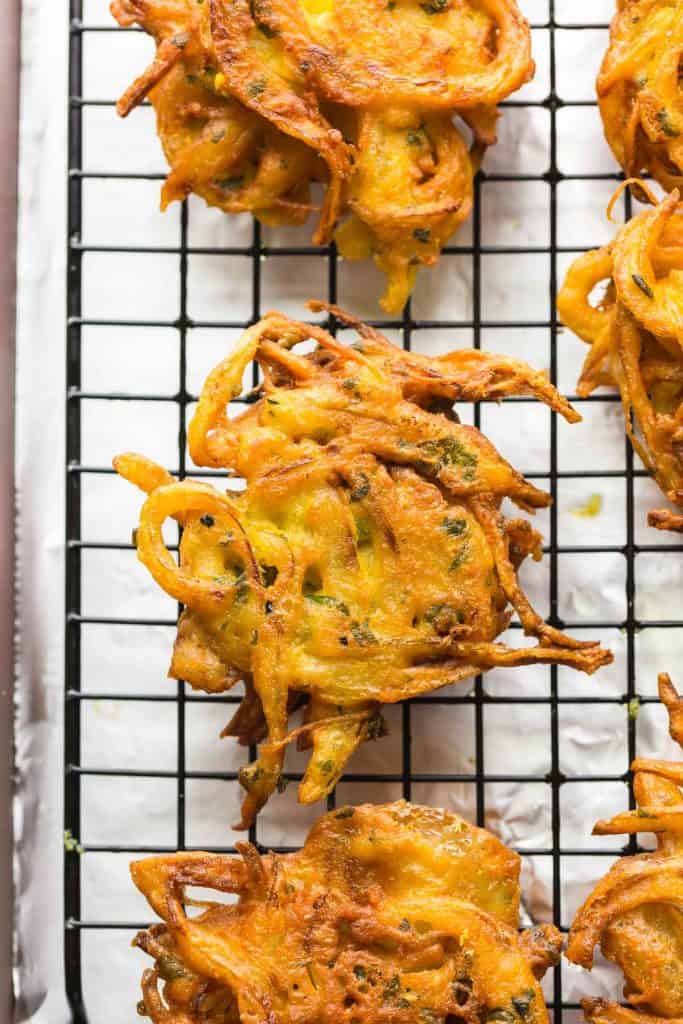onion bhajis cooling on a wire rack