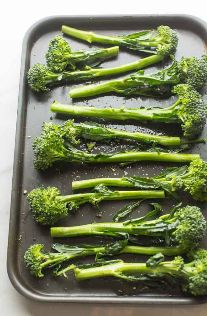 raw tenderstem broccoli on a baking sheet