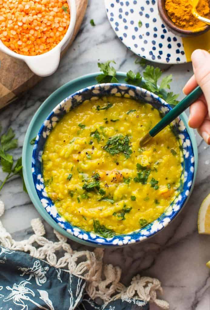 Arabic Lentil Soup in a bowl topped with fresh parsley