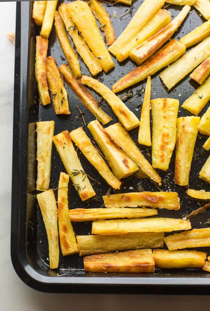 Honey Roast Parsnips on a roasting pan