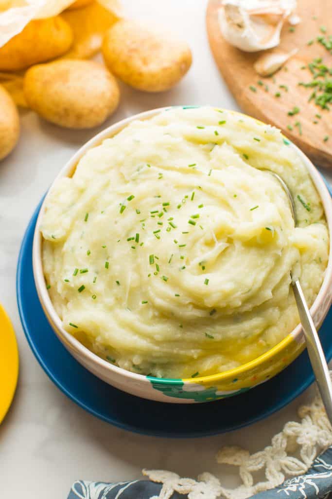 Vegan Mashed Potatoes without Milk in serving bowl with spoon