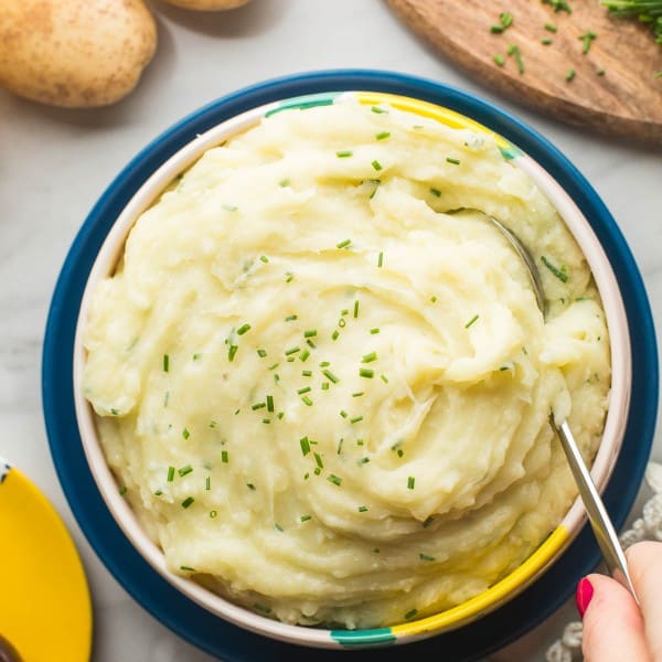 Vegan Mashed Potatoes without Milk in serving bowl with spoon