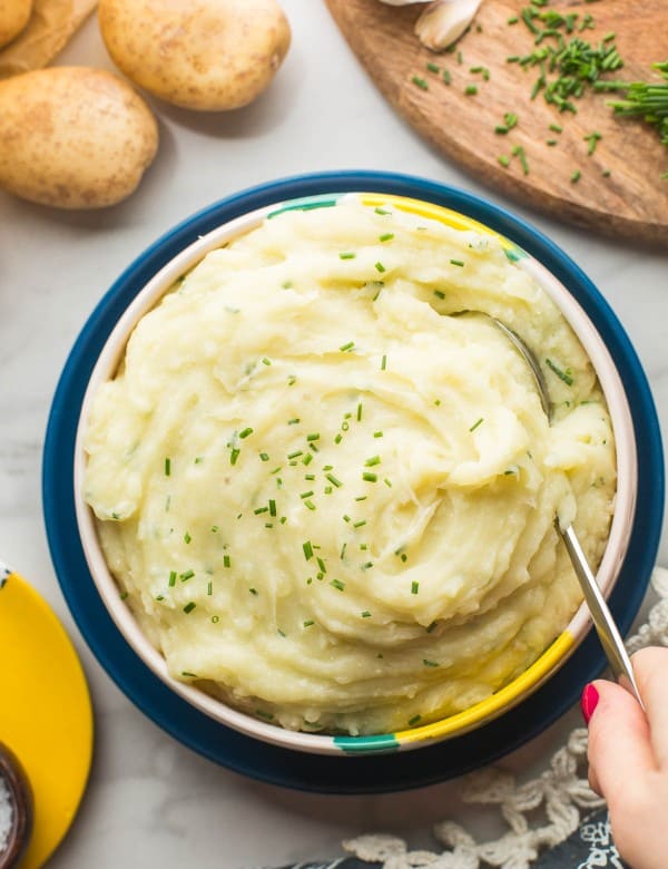 Vegan Mashed Potatoes without Milk in serving bowl with spoon