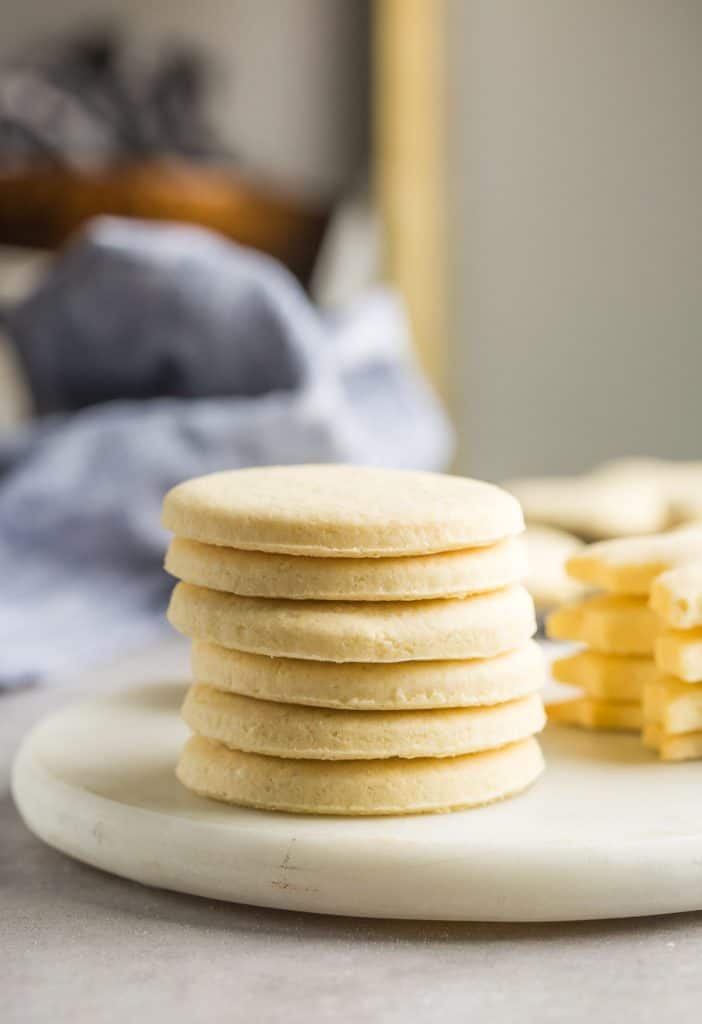 a stack of round, cut out Gluten Free Sugar Cookies 