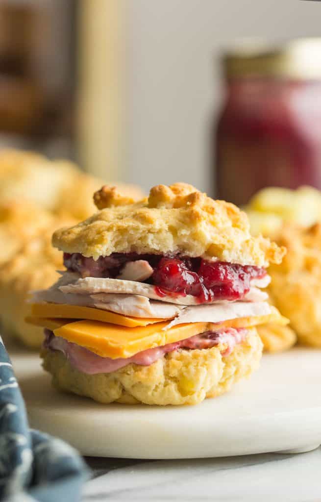 mashed potato biscuits used as a sandwich bun with turkey, cheese and cranberry sauce